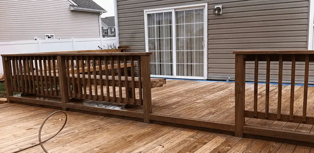 Deck sealing service protecting a backyard wood deck and railings in Raleigh, NC