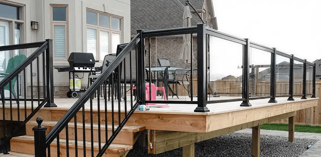 Handrail installation on a deck staircase for safety and code compliance in Raleigh, NC